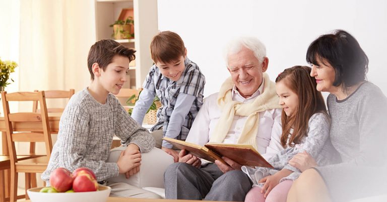 Grandparents gather together with their grandchildren