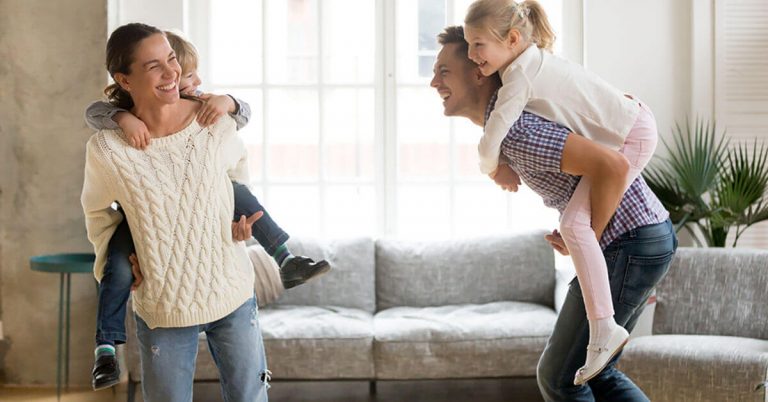A mom spending time with her family in a clean house.